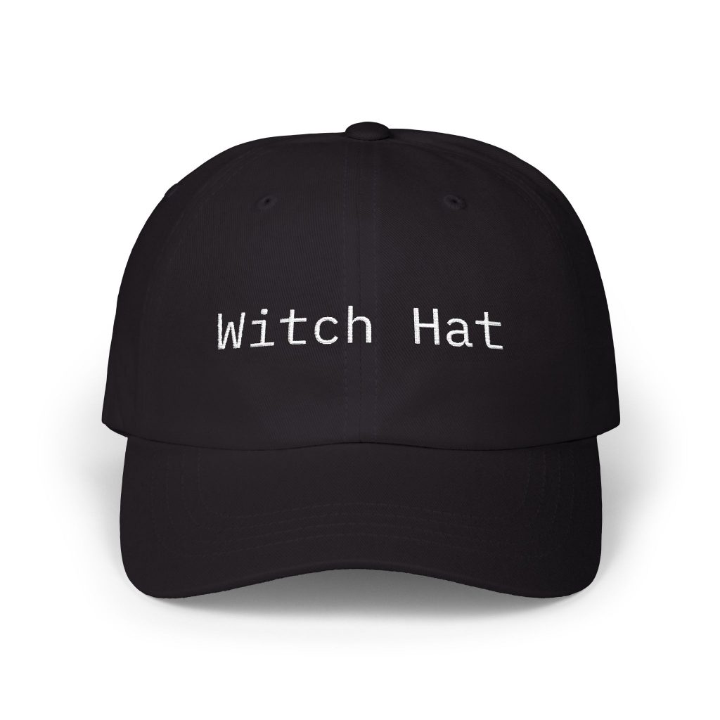 Black dad cap with "Witch Hat" embroidered in white monospace text