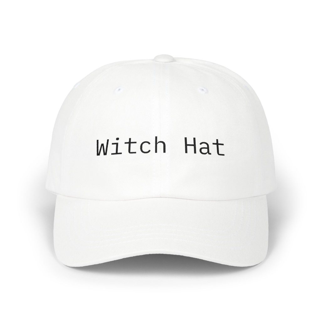 White dad cap with "Witch Hat" embroidered in black monospace text